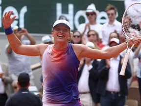 Poland's Iga Swiatek celebrates her victory over Italy's Jasmine Paolini after their women's singles final match on Court Philippe-Chatrier on Day 14 of the French Open tennis tournament at the Roland Garros Complex in Paris on June 8, 2024.