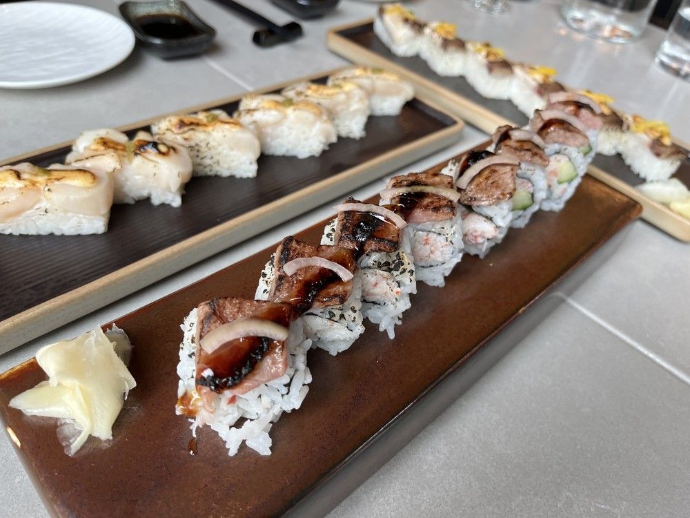  from left to right, hotate (scallop) aburi and wagyu aburi at jfuse aburi & bar on main street.