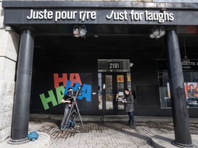 A news crew shoots a report in front of the Just for Laughs theatre is seen Tuesday, March 5, 2024 in Montreal. The company that runs the annual comedy festival has filed for bankruptcy protection.THE CANADIAN PRESS/Ryan Remiorz