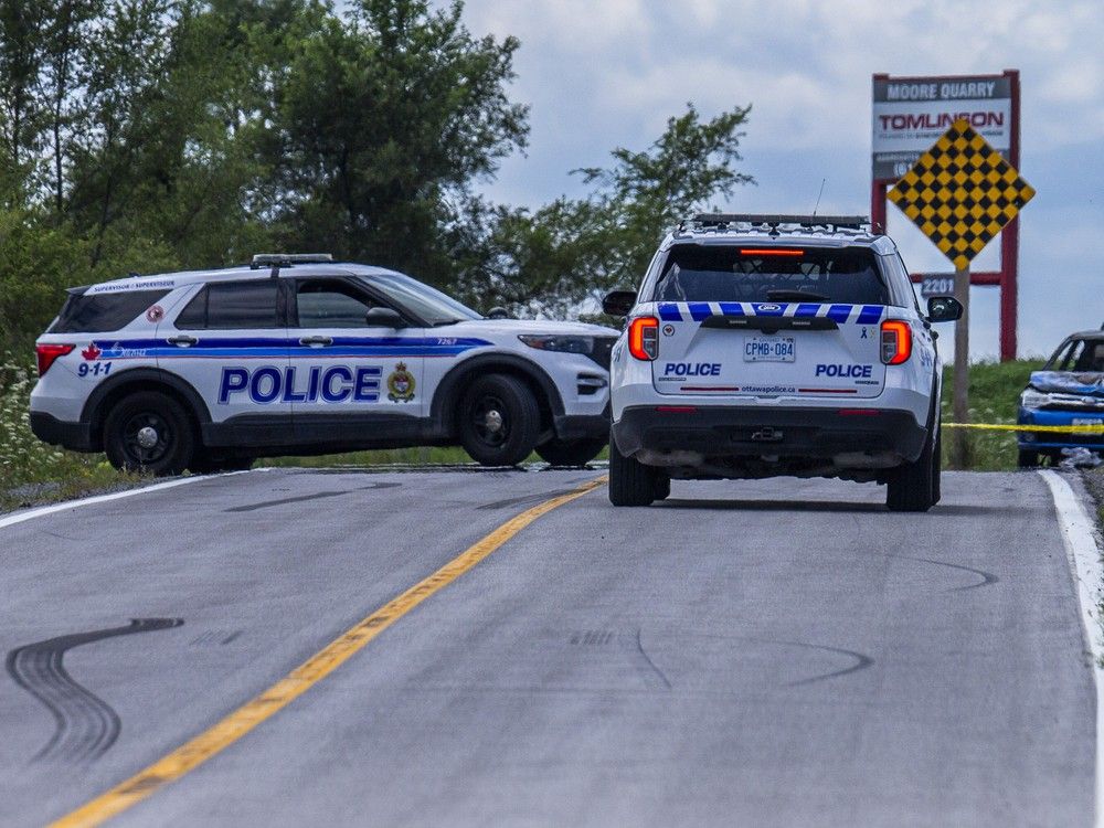 Ottawa police were parked at the scene of a vehicle fire on Speedway Road, west of Stittsville. 
