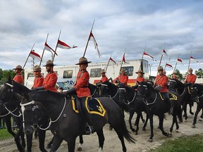 Members of the RCMP Musical Ride ride past fans as they prepare to perform at the Sunset Ceremony in Ottawa on June 30, 2024. PHOTO BY CHRISTOPHER NARDI/NATIONAL POST