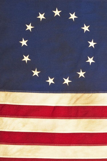 This American Colonial Flag, popularly attributed to Betsy Ross, was designed during the American Revolutionary War features 13 stars to represent the original 13 colonies. According to the legend, the original Betsy Ross flag was made on July 4, 1776.