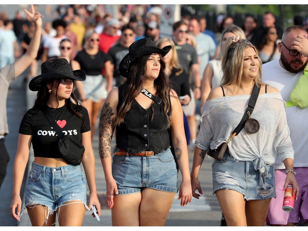 Girls in cowboy hats and cutoff shorts at bluesfest