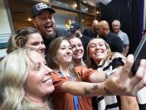 Jelly Roll takes a photo with some fans Tuesday while at the Royal Ottawa Hospital to perform a mini concert.