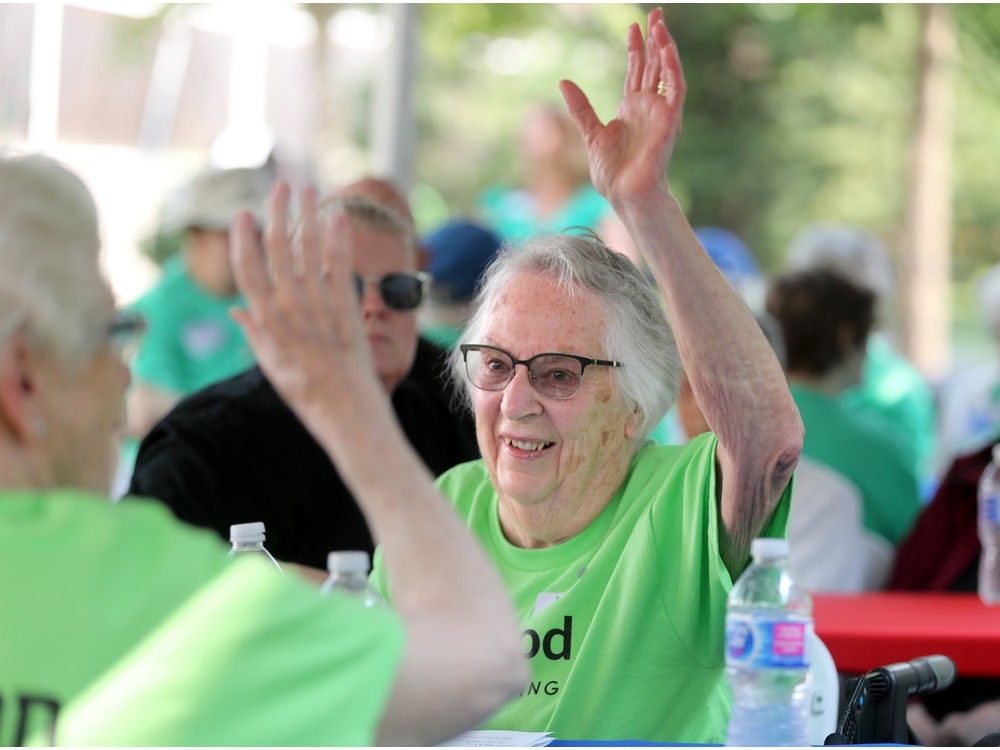  anne stafford, 88, who was competing in the 1.6 km walking event, gets a high five from a teammate.