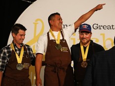 Lizardo Becerra Raphaël Peruvian Cuisine celebrates his victory alongside second place finisher Jason Sawision of Stofa Restaurant and third place finisher Mitch Lacombe of Gitanes during Canada's Great Kitchen Party held at the Chateau Laurier in Ottawa