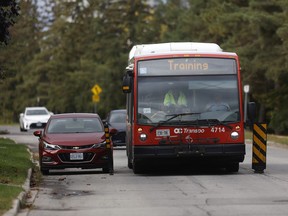 Bus drives around flex boards on street