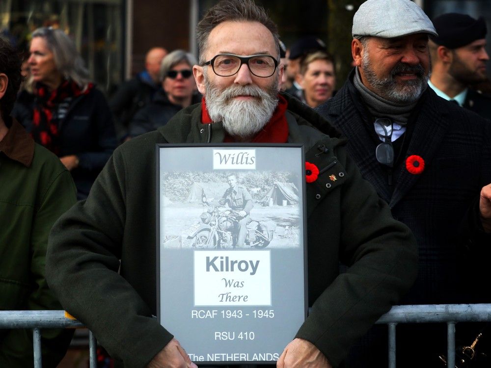  barry kilroy holds up a sign that had special meaning for him.