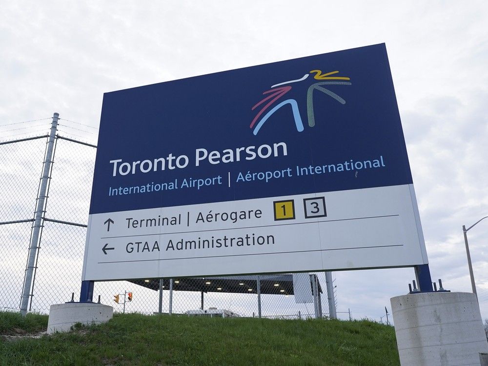  a sign for toronto pearson international airport is pictured in this file photo. a cbsa officer who worked at the airport claimed a knee injury prevented him from working on sundays.