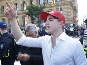 Protestor Josh Alexander at a downtown Ottawa protest in this file photo. Alexander lost a court challenge to be reinstated to his high school after being expelled.