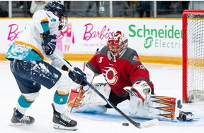 Ottawa Charge goaltender Emerance Maschmeyer stretches out to make a pad save on New York Sirens forward Jade Downie-Landry during the game Monday night.