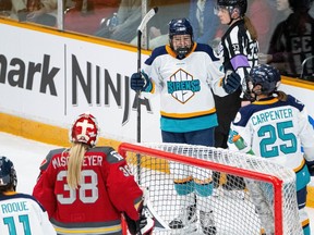 Jessie Eldridge celebrates her third-period power-play goal on Ottawa Charge goaltender Emerance Maschmeyer on Monday night.