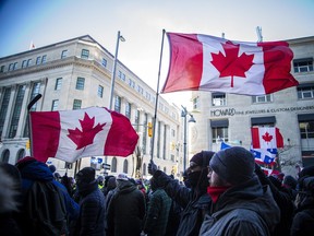 Police from all different forces across the country joined together to try to bring the convoy occupation to an end in this file photo from Saturday, February 19, 2022. Early that evening protesters had what felt like a last hurrah party at the corner of Sparks Street and Bank Street as police held a line across Bank.