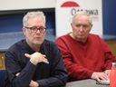 Kevin Skerrett of the Ottawa Health Coalition speaks while Ken Harten looks on at a news conference on Tuesday, Feb. 18, 2025. Skerrett said for-profit companies have a conflict of interest when it comes to advising patients about their health needs.
