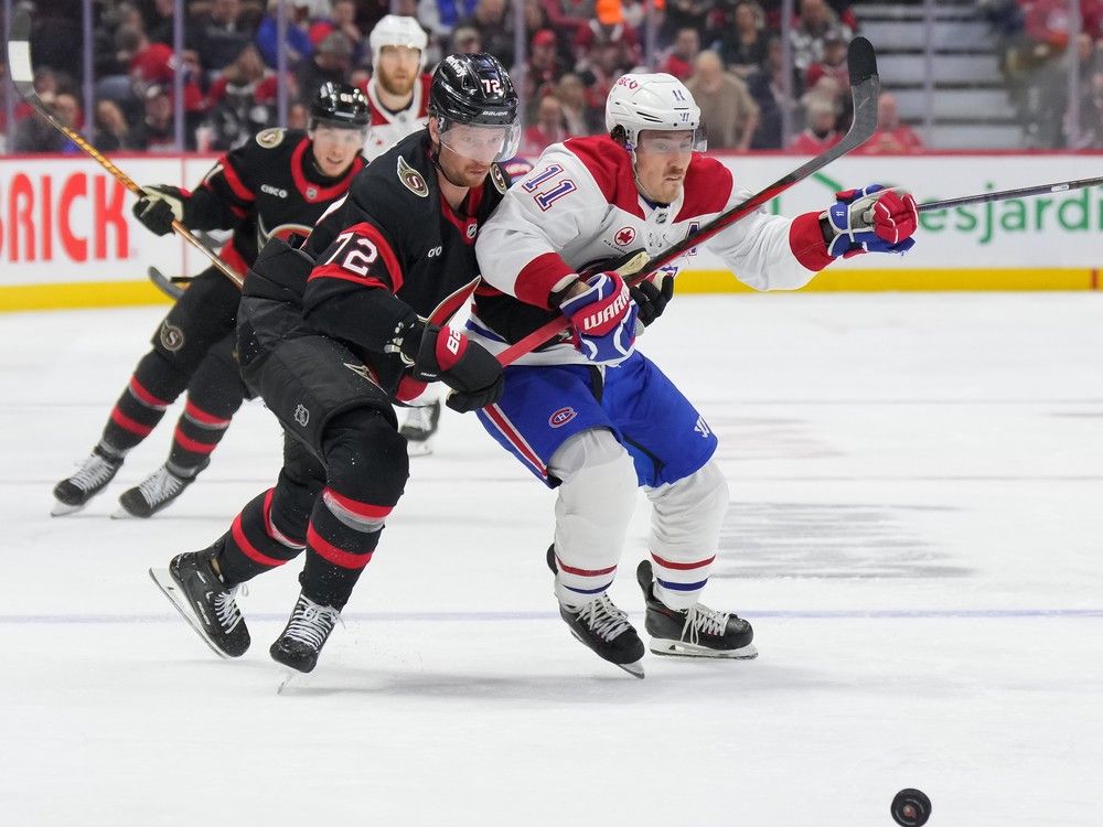Thomas Chabot of the Ottawa Senators battles for the puck with Brendan Gallagher of the Montreal Canadiens during the third period at the Canadian Tire Centre on Feb. 22, 2025.