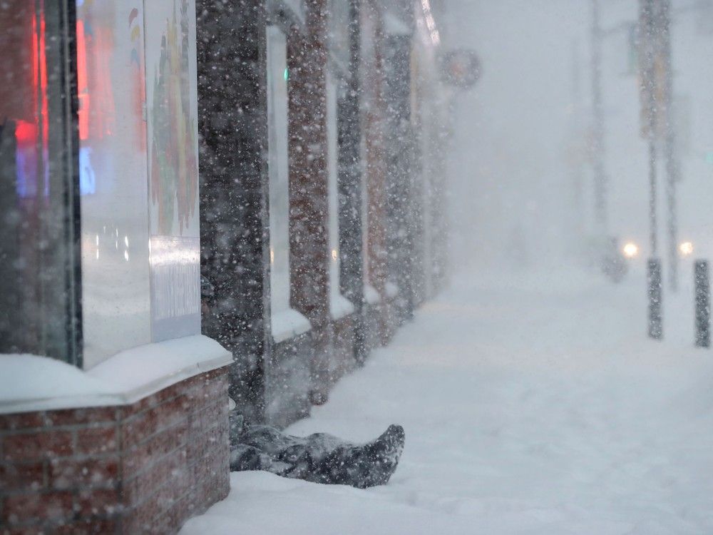 homeless person in doorway in winter