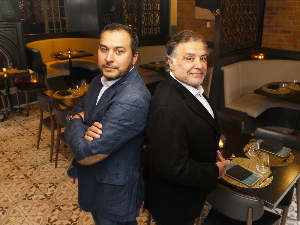  Tony Garcia (left) and Hussain Ruhal, the co-owners of Fairouz, pose for a photo Tuesday.