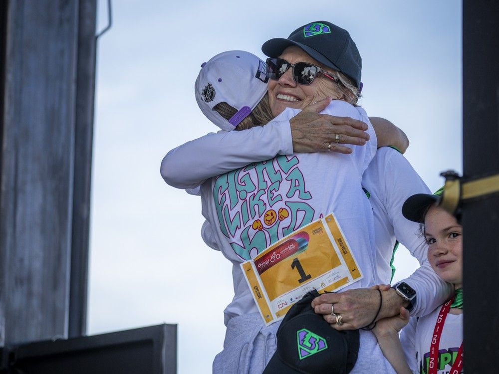  Kathleen Both of Carpe Diem and Tamy Bell from Griffs Gang shared a great big up on stage after the two teams tied for top fundraising. Both has two grandchildren battling cancer and Bell lost her son last year after a gruelling battle with the disease.