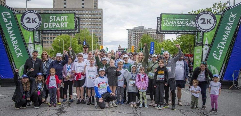  A large group of Tamarack employees and family members posed for a photo before the start of the 2K race Saturday.