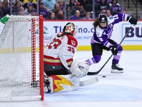 Kelly Pannek of the Minnesota Frost shoots the puck on Gwyneth Philips of the Ottawa Charge, scoring the first goal of the game
