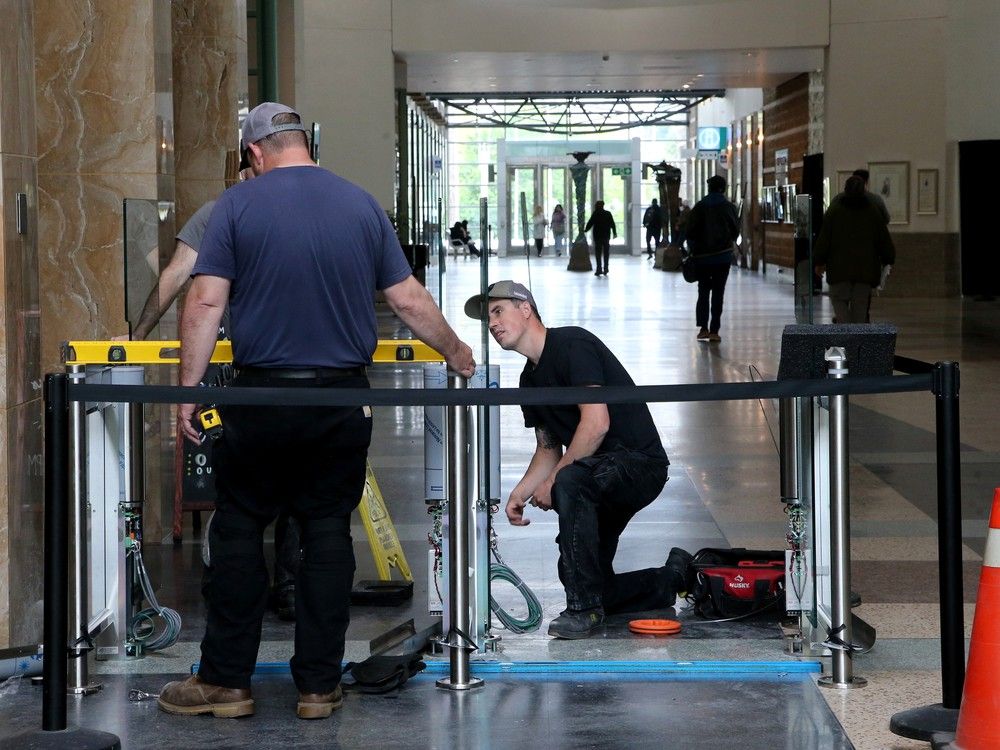  Bollards now stretch across the entrance to Ottawa City Hall as a security measure.Also, new security equipment was being installed at the main entrance of Ottawa City Hall May 21st as well as the city will soon x-ray bags and put people through metal detectors before they’re allowed into city hall.