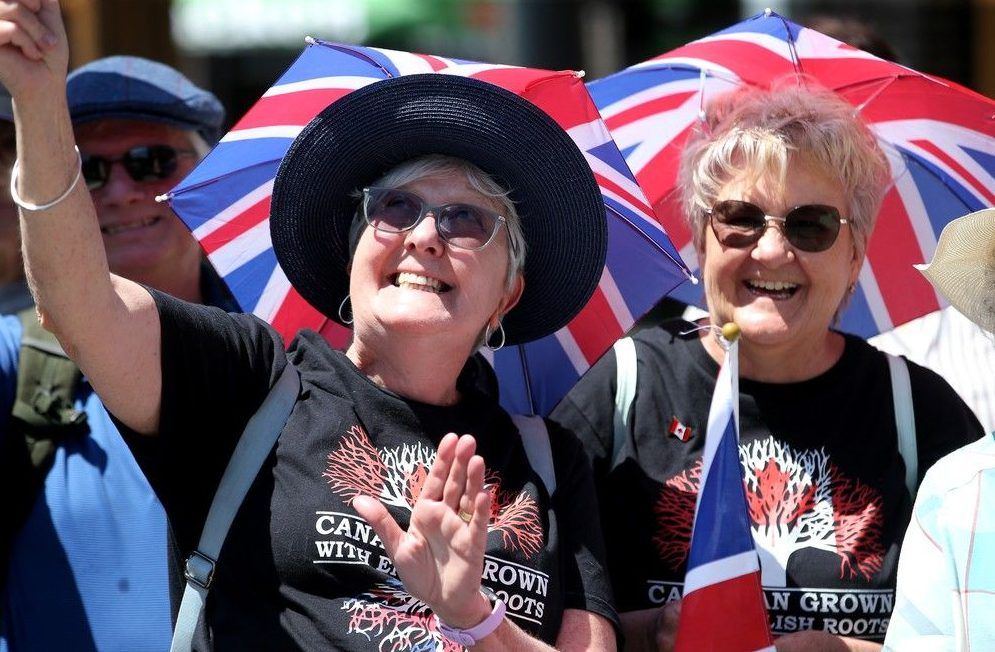  Monarchy fans Debbie Guiry (left) and Susan Fleming, donned their Union Jack umbrella hats for the royal arrival.