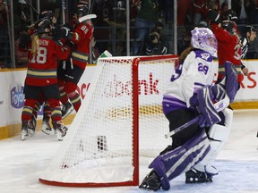 The Ottawa Charge celebration begins as Minnesota goalie Nicole Hensley leaves her goal crease after giving up an overtime goal to Emily Clark on Tuesday night.