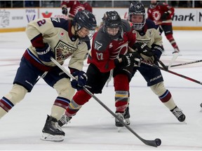 Ottawa's Gabbie Hughes (centre, 17)