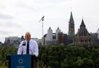 Tobi Nussbaum, CEO of the National Capital Commission, speaks during the official re-opening of the revitalized Kìwekì Point. Parliament Hill is visible in the background.
