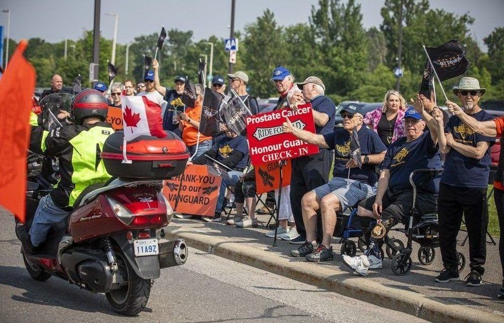 As the bikes pulled out, a group known as the Vanguard — prostate cancer survivors and their supporters in matching blue shirts — lined the route, cheering riders on.