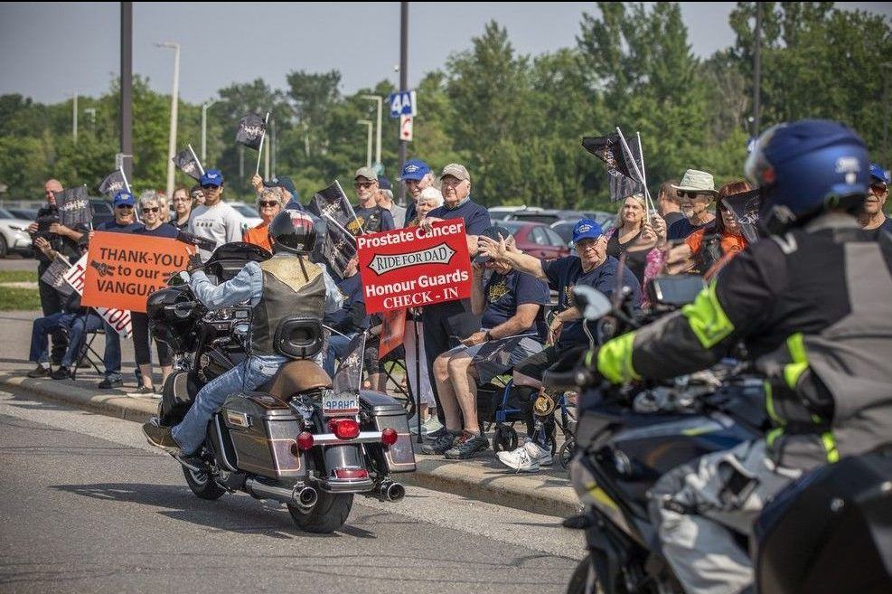  As the bikes pulled out, a group known as the Vanguard — prostate cancer survivors and their supporters in matching blue shirts — lined the route, cheering riders on.