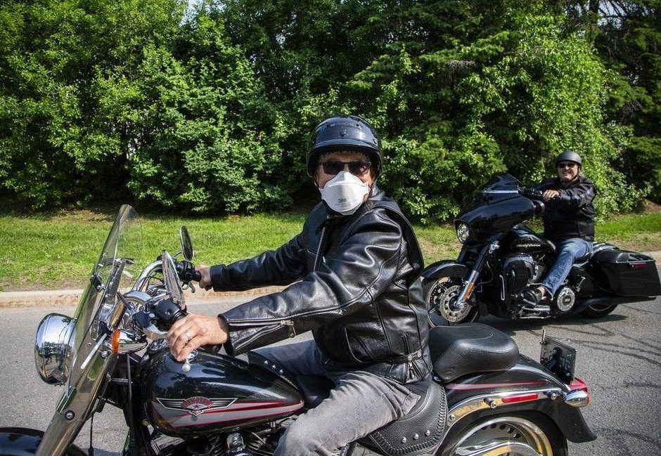  A rider wears a mask as a precaution against lingering wildfire smoke in the Ottawa area on Saturday.