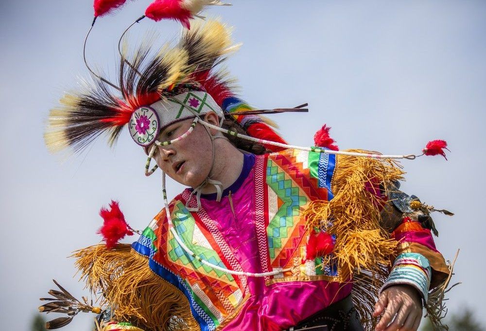  Dancers took part in the Grand Entry to begin the powwow Saturday afternoon under the hot sun, their regalia dancing in the wind and shimmering with vibrant, stunning colours.