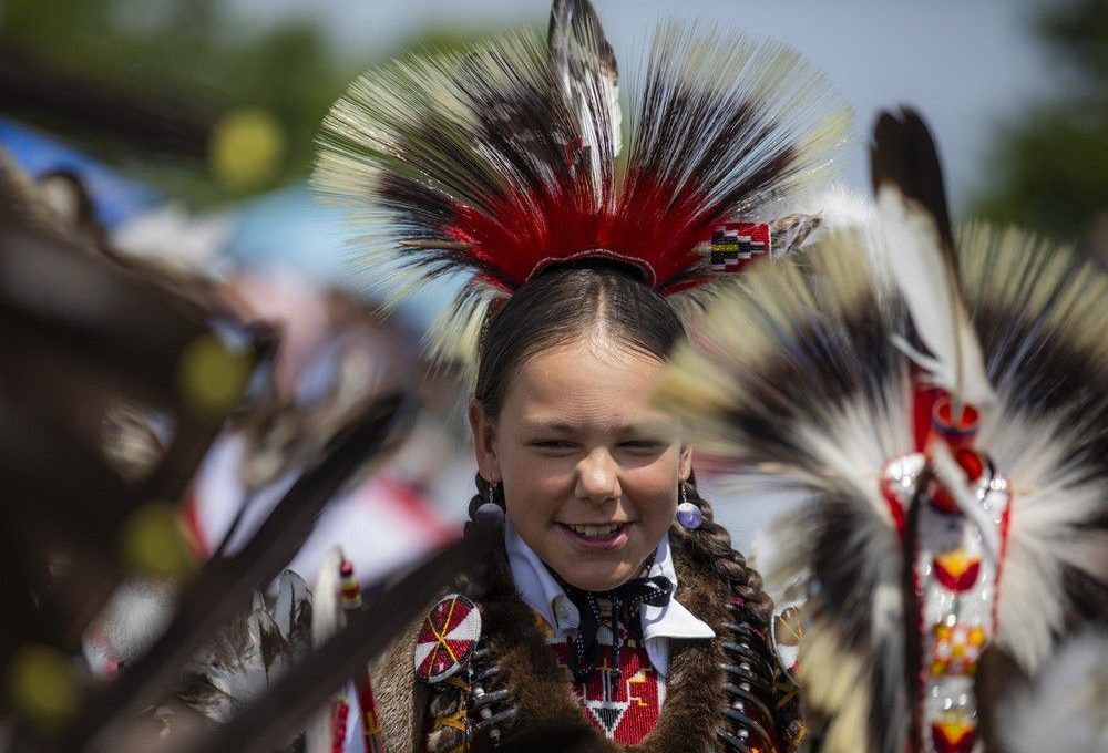  Dancers took part in the Grand Entry to begin the powwow Saturday afternoon under the hot sun.
