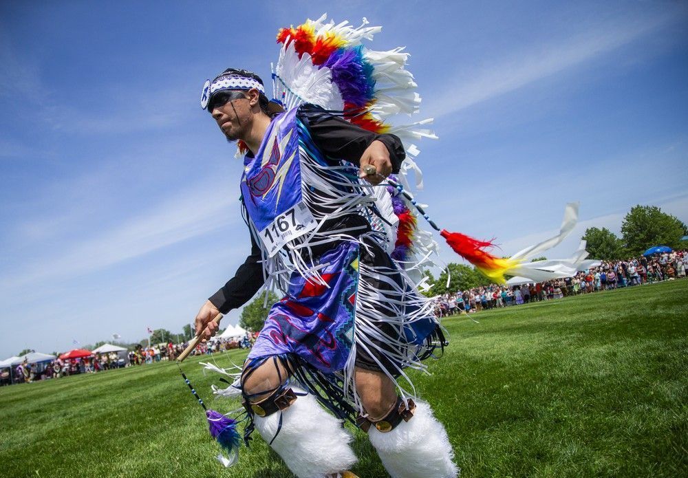  Dancers took part in the Grand Entry to begin the powwow Saturday afternoon under the hot sun, their regalia dancing in the wind and shimmering with vibrant, stunning colours.