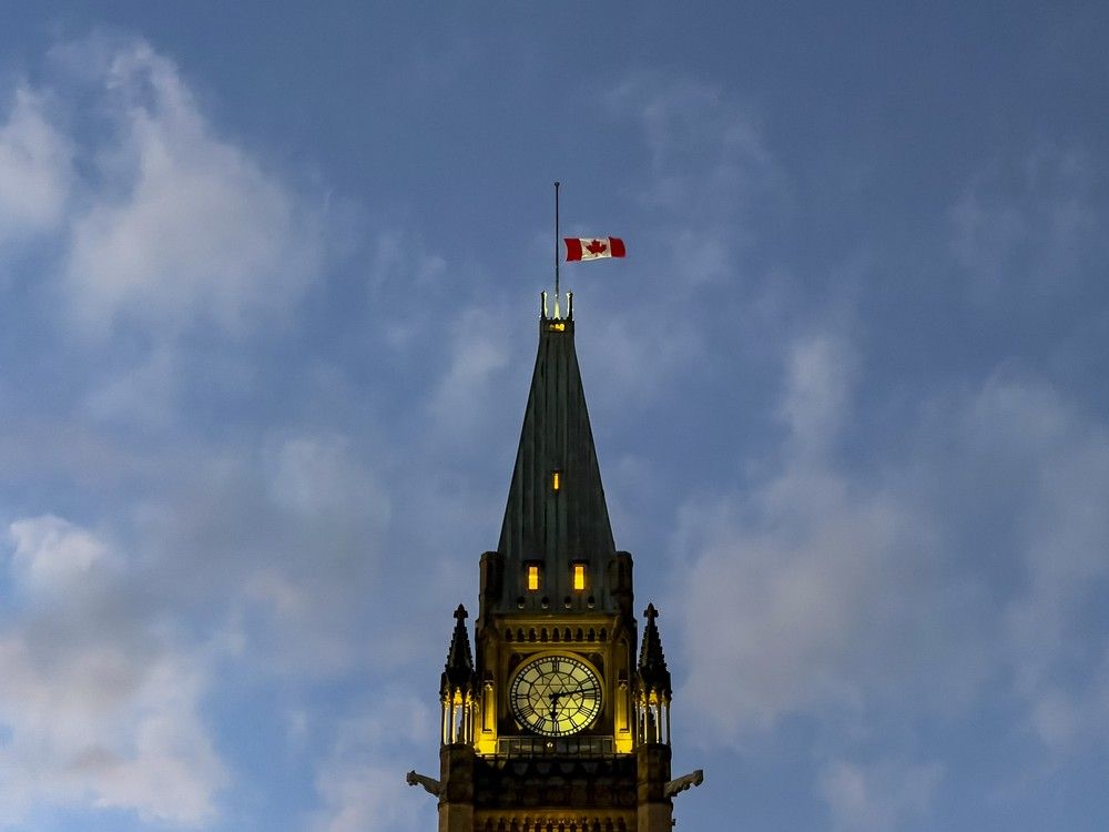OTTAWA — The Canadian flag flies at half mast atop the Peace Tower on Parliament Hill at sunset. Monday, Nov. 1, 2021 — . ERROL MCGIHON, Postmedia OTTAWA — The Canadian flag flies at half mast atop the Peace Tower on Parliament Hill at sunset. Monday, Nov. 1, 2021 — . ERROL MCGIHON, Postmedia