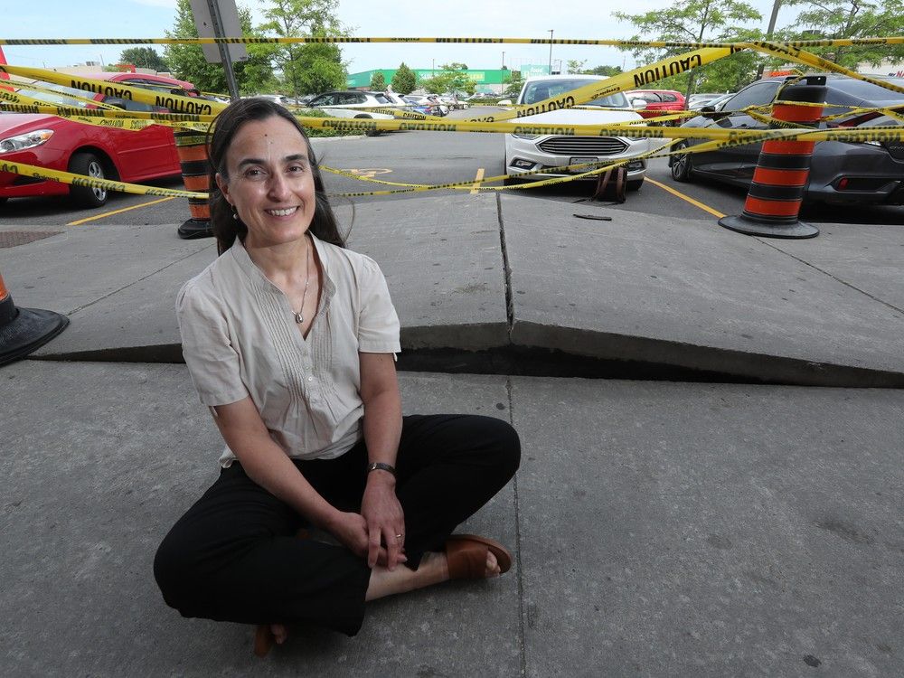  Beatriz Martin-Perez, a civil engineering professor at the University of Ottawa, explains how heat affects concrete like this heaved sidewalk in front of the Goodlife Fitness at Herongate Mall.