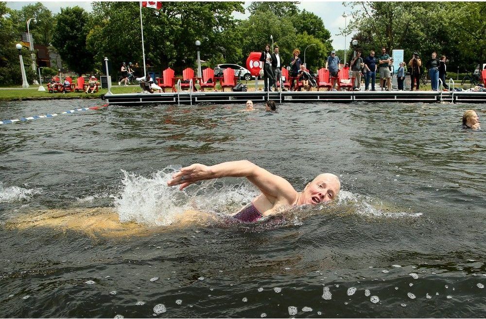  Former Ottawa Centre MP and cabinet minister Catherine McKenna swims laps in Dow’s Lake after the official inauguration of the NCC’s new recreational dock on Thursday.