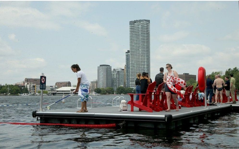  The new recreational dock at Dow’s Lake is located just off the Queen Elizabeth Driveway. It has a roped-in swimming area and lots of Adirondack chairs for lounging. Maya Lawson, far left, a water-quality assistant with the Ottawa Riverkeeper, said Dow’s Lake was “very clean” with E. Coli measuring just five per 100 mL of water on Thursday.