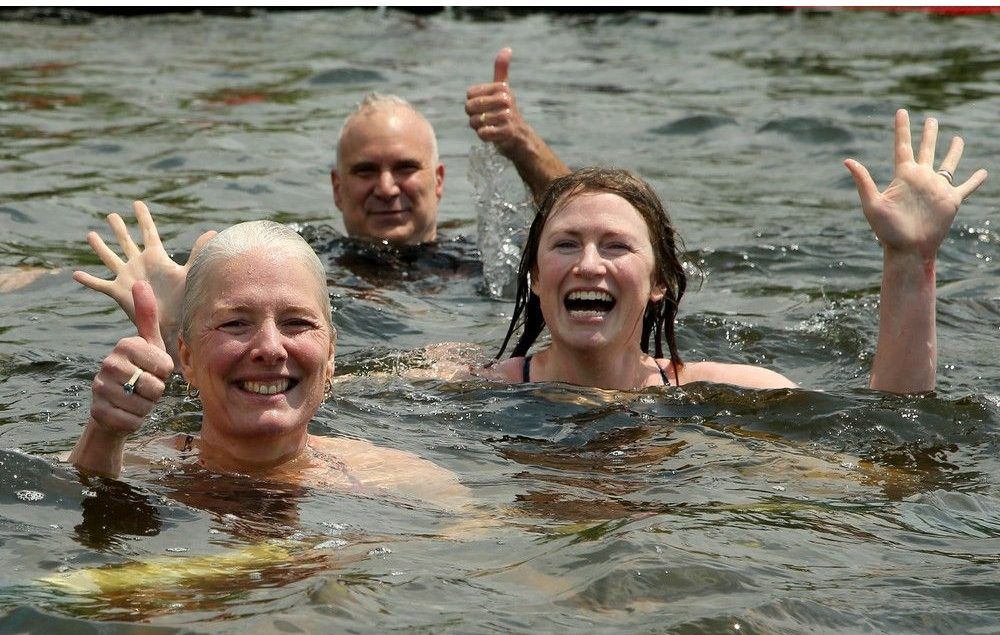  National Capital Commission CEO Tobi Nussbaum, rear, former Ottawa Centre MP and cabinet minister Catherine McKenna, left, and Laura Reinsborough, right, riverkeeper and CEO of Ottawa Riverkeeper, were among those who jumped into Dow’s Lake on Thursday for the inauguration of the new recreational dock, an NCC pilot project.