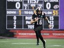 Redblacks quarterback Dustin Crum runs with the football in the first half of Saturday's game against the Stampeders.