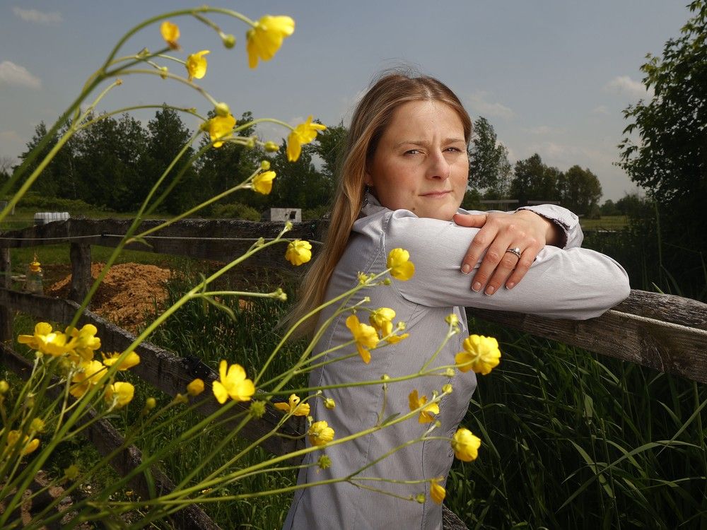  Courtney Argue poses for a photo at her farm just south of Dunrobin Tuesday. There is a controversy over a proposal to build a massive battery energy storage system on Marchurst Road. Argue is among those who object to the project.