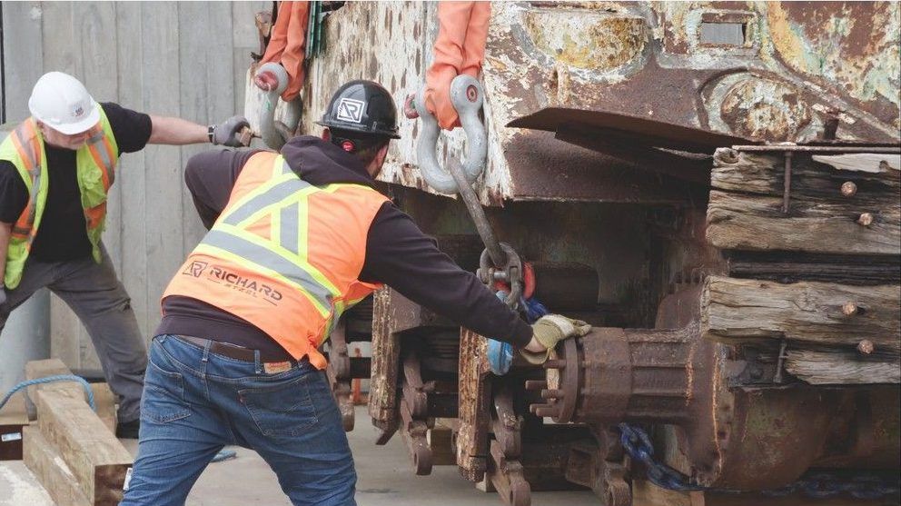  Workers unload the hull of a Sherman Beach Armoured Recovery Vehicle (BARV) at the Canadian War Museum. The restoration of the BARV will be cosmetic in that it will be prepared for display at the museum in Ottawa, but will not be in running order.