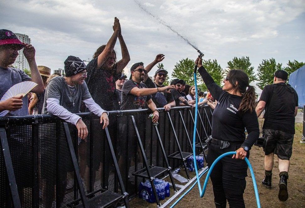  Bluesfest security cool down the crowd with a spray of water just before Kurt Vile & The Violators opened the Saturday night performances on the RBC Stage.