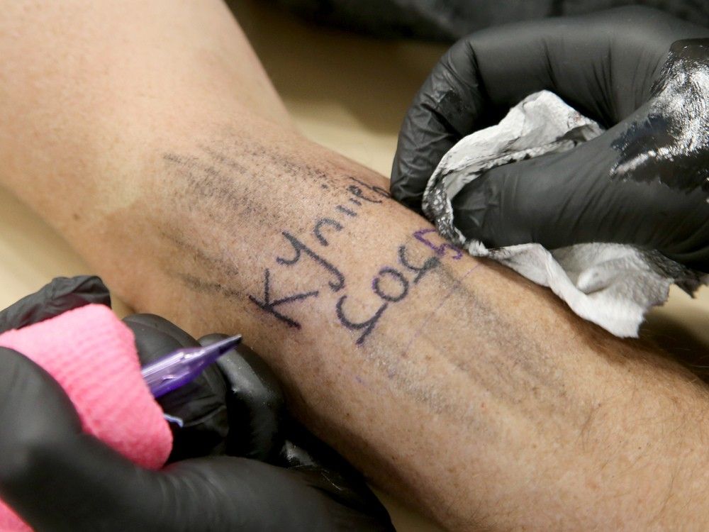  A closeup of the tattoo on Ryan Buzzie’s arm featuring daughter Kynlie’s handwriting, complete with her “backwards 2’s, which I love,” her dad said.