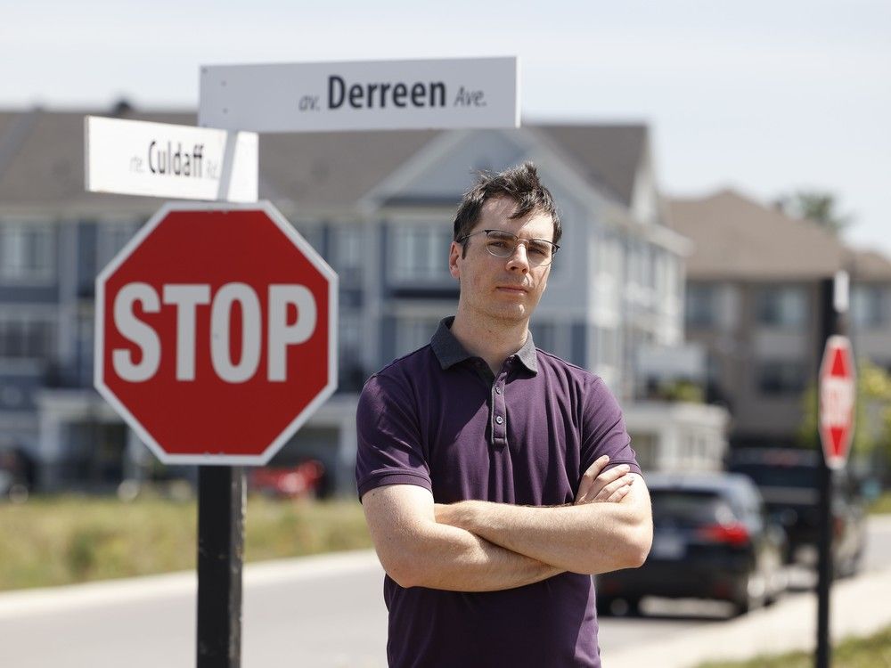  Tyler Sommers poses for a photo at the intersection of Derreen Avenue and Culdaff Road in Stittsville. Residents of a new Stittsville development are worried about the removal of a four-way stop, the only place along the busy street that pedestrians can legally cross.