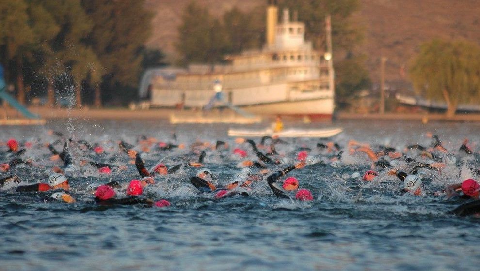 File photo: Competitors swim during the first leg of an IRONMAN triathlon in Penticton, B.C. In Ottawa, the event will start at 6 a.m. Sunday with a 3.8-kilometre swim at Britannia Beach. That will be followed by a 180-kilometre bike ride through local neighbourhoods and will wrap up with a 42.2-kilometre run centred around Parliament Hill.