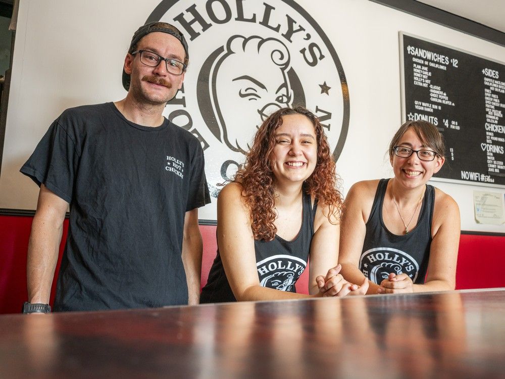  Co-owners Steve Watt, left, and Holly Laham, right, flank staffer Stephanie Tremblay on Saturday, Aug. 9, 2025. The beloved chicken sandwich spot will be flying the coop for good on Aug. 16, as the owners have decided it’s time to close this chapter.