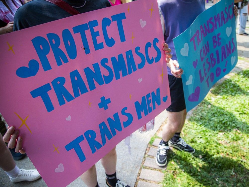  A group gathered in Minto Park on Saturday before marching onto Elgin Street for the annual Dyke March.