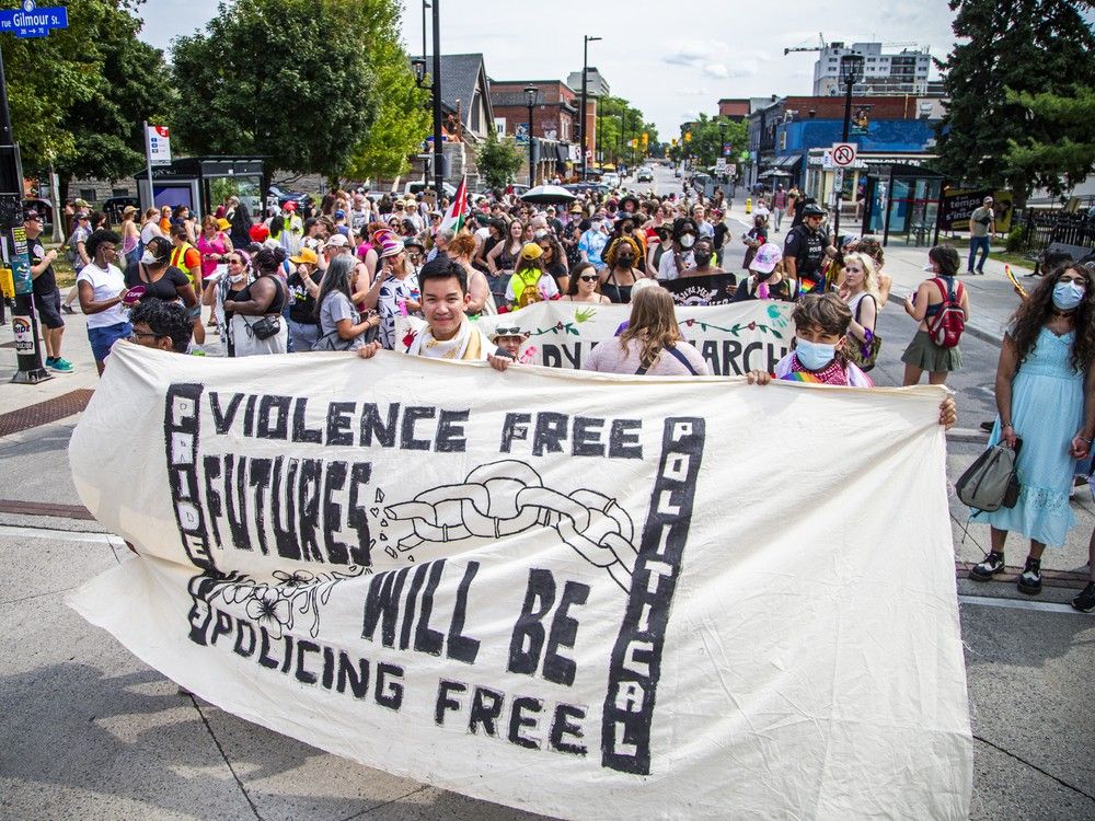  A group gathered in Minto Park on Saturday before marching onto Elgin Street for the annual Dyke March.